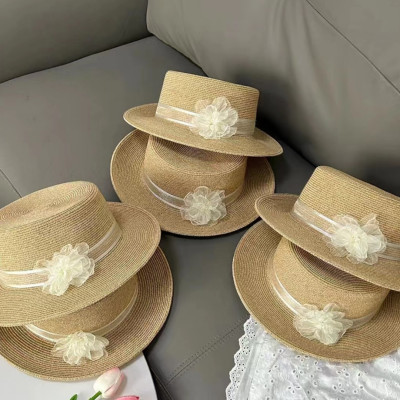 Nón đi biển mũ rộng vành phớt cao bồi cho nữ đai trắng gắn hoa xinh chất liệu cói chống nắng thoáng mát thời trang Hàn Quốc dona240707